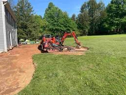 Rough and finish grading for smooth, even, and well-drained properties